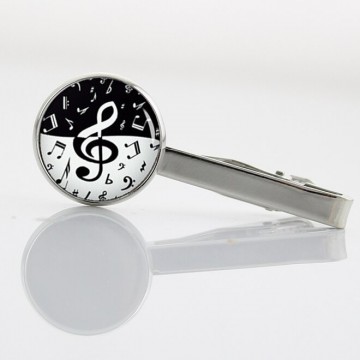 Dasspeld rond vioolsleutel muziektekens