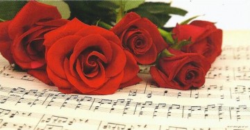 Wenskaartje bladmuziek met rode rozen